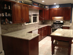 River white granite with dark cherry kitchen cabinet