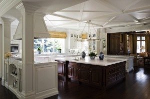 Oversized mocha kitchen island and honed carrara marble countertop.